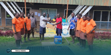 Constituency Project Officer (CPO), Stephen Lupeqeto handover ICT equipment and solar system set to Leona Community High School management rep, witnessed by students.