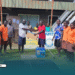 Constituency Project Officer (CPO), Stephen Lupeqeto handover ICT equipment and solar system set to Leona Community High School management rep, witnessed by students.