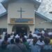 Part of congregation witnessing the opening of the church