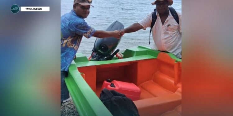 A community representative receives boats and engines on behalf of his community.