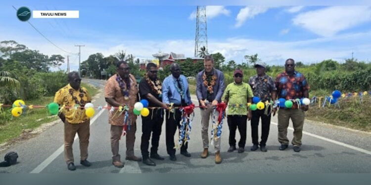Cutting the ribbon to official open the Noro Road Improvement Project.