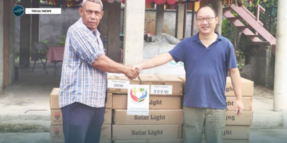 Justin Tanema, Constituency Development Officer (CDO) for TVC receives the donated goods and supplies from PRC Embassy, Head of Political Section Gu Wenlong.