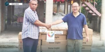 Justin Tanema, Constituency Development Officer (CDO) for TVC receives the donated goods and supplies from PRC Embassy, Head of Political Section Gu Wenlong.