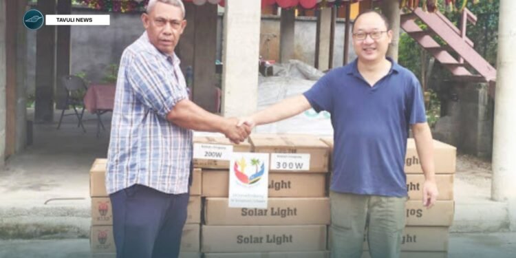 Justin Tanema, Constituency Development Officer (CDO) for TVC receives the donated goods and supplies from PRC Embassy, Head of Political Section Gu Wenlong.