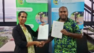 MALD Permanent Secretary Dr Samson Viulu and WVSI National Director Ms Asuntha Charles with the signed MOU