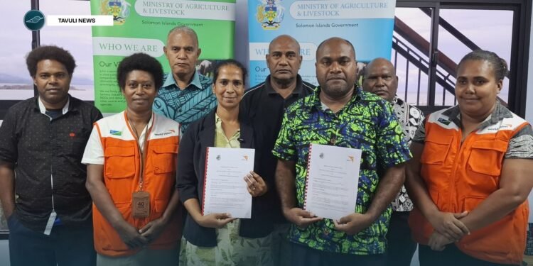 MALD Permanent Secretary Dr Samson Viulu and W ... ntha Charles with staff from MALD and WVSI