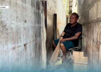 In a narrow alley in Honiara, Leah keeps going