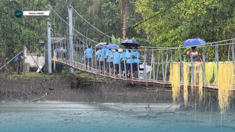 Kukudu students across the new bridge. Photo: Tavuli News- Solomon Islands