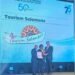 Tourism Solomons Acting CEO Dagnal Dereveke - centre is pictured receiving the award from on left) PATA CEO Noor Ahmad Hamid and on right PATA Chair Peter Semone. 