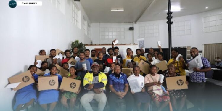 Derrick Manu’ari, together with Smart Technology Managing Director Rolex Sitana, seated in the front row, centre, along with constituency officers and student recipients during the handover last Thursday.