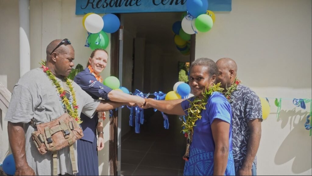 Caption: Minister Counsellor Stephanie Aeuckens handing over the Central Province
Council of Women Conference Facility.
