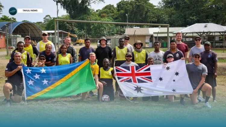 HMAS Yarra crew and personnel from Royal Solomon Islands Police Force after a playing soccer at Hells Point Explosive Ordnance Disposal facility in Honiara, Solomon Islands.