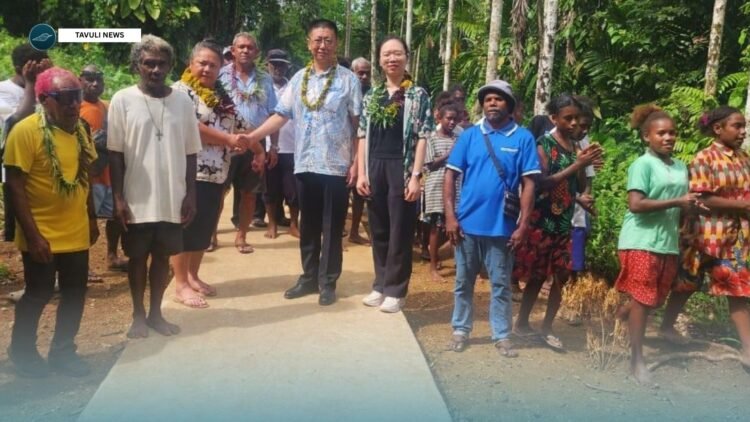 MP Choylin Douglas, MP and Counsellor Zhao representing the PRC Embassy in Solomon Islands with community members during the handover program.