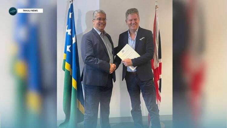 British High Commissioner, HE Paul Turner, with PS Finance, David Dennis, signing the next phase of UK support