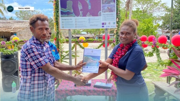 Ms. Anquine Nerry, Senior Fisheries Officer handing over CFMP to Karumulun
Resource Management Committee Vice Chairperson.