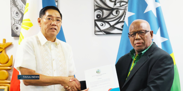 Foreign Affairs Minister Rick Houenipwela (right) congratulates Johnny Sy following his appointment as the Philippines' honorary consul to Solomon Islands. Photo: MFAET
