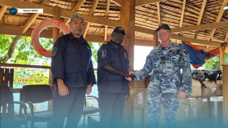 Assistant Defence Advisor, Squadron Leader Brett Verity officially hands over the new working uniforms to RSIPF Maritime Director Nevol Soko and Explosive Ordnance Disposal Director Clifford Tanuki during a ceremony at Aola Wharf.