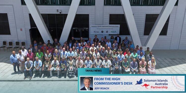 Delegates, employers, government representatives and partners gather for a group photo during the PALM Expo in Honiara.